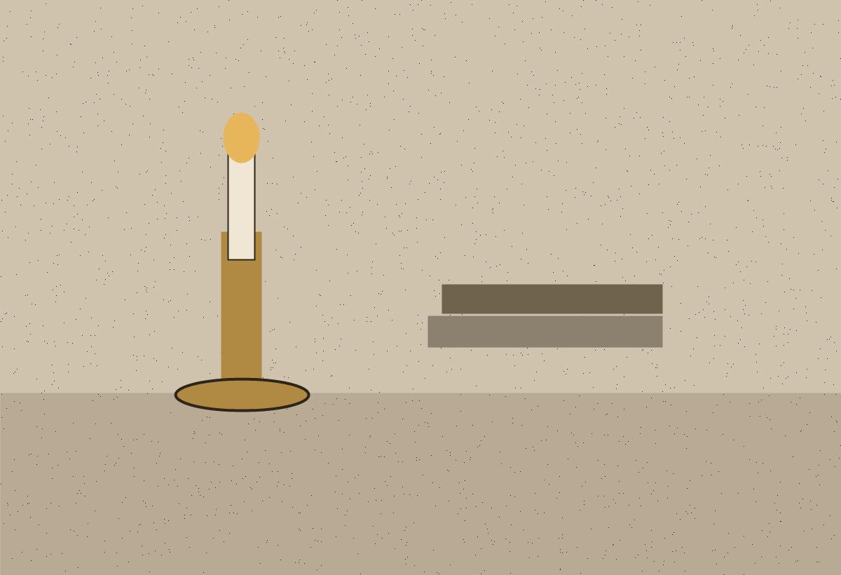 A brass candlestick beside a small stack of worn books.